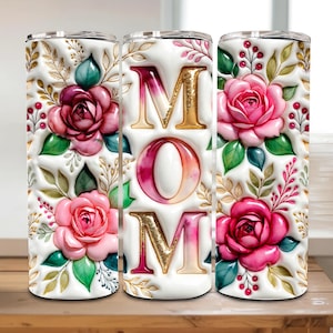 May include: A set of three ceramic mugs with a speckled, matte finish. The mugs are in shades of cream, light gray, and dark gray. Each mug has a simple, minimalist design and a rounded handle.