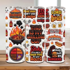 May include: A white grilling tumbler with various grilling-themed graphics and text. The tumbler features images of flames, grilling tools, and food items like burgers and hot dogs. Text includes phrases like "Lord of the Grill" and "This is my grilling cup."