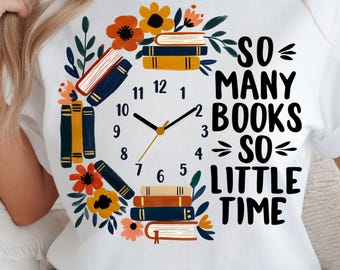 May include: White t-shirt featuring a clock design made of books and flowers. The clock hands point to 2:10. Text reads "SO MANY BOOKS SO LITTLE TIME" in black. The design includes orange, yellow, blue, and brown colors.