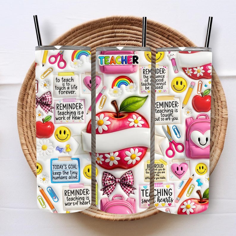 May include: Three white 20 oz. insulated tumblers with black straws, decorated with teacher-themed designs. Each tumbler features an apple, rainbows, daisies, and text like "TEACHER" and "Reminder: teaching is a work of heart."
