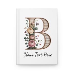 Könnte beinhalten: Ein weißes Notizbuch mit floralem Design und dem Buchstaben "B". Der Buchstabe ist mit Noten gefüllt und von rosa und cremefarbenen Rosen, grünen Blättern und kleinen Herzen umgeben. Der Text "Your Text Here" steht in schwarzer Schrift unten.