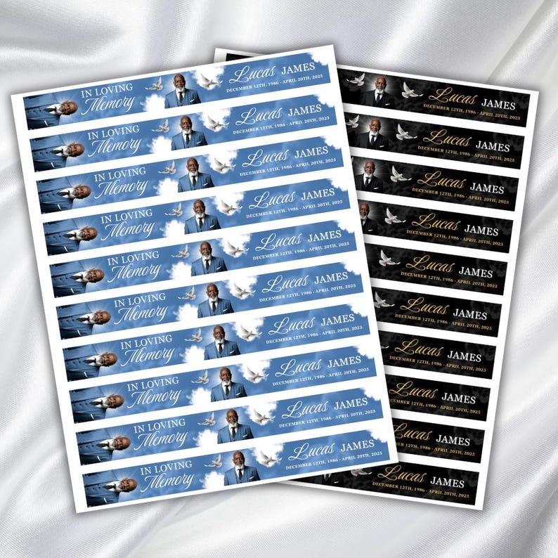 Puede incluir: Hojas de pegatinas conmemorativas con el texto "IN LOVING MEMORY" y "Lucas James" impreso. Las pegatinas presentan un retrato de un hombre, palomas y fechas sobre un fondo azul y negro.