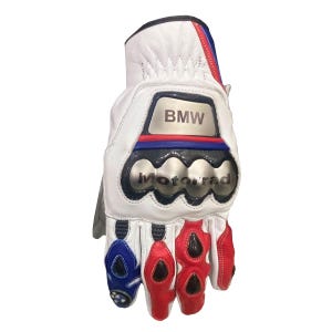 May include: White motorcycle glove with the BMW logo and "Motorrad" text. The glove features red, blue, and black accents, with protective padding on the knuckles and fingers. The glove is made of leather.