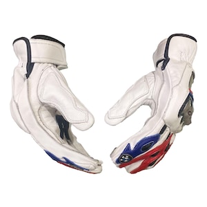 May include: A pair of white leather motorcycle gloves with black accents. The gloves feature red, blue, and white detailing on the knuckles and wrist. The gloves are designed for protection and performance.