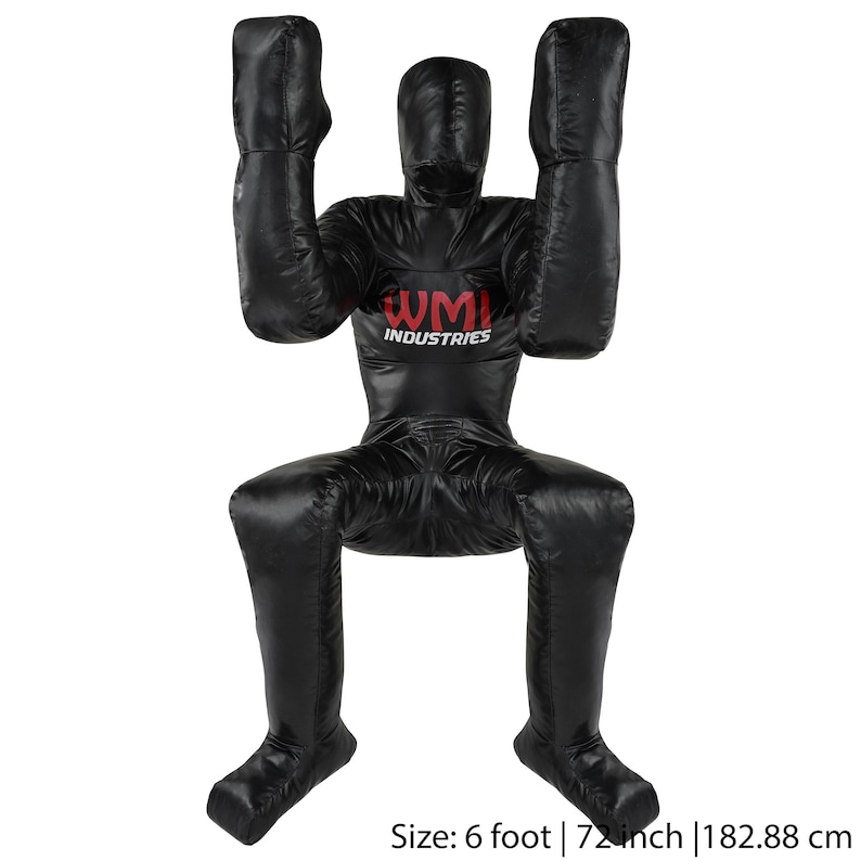 May include: Black freestanding training dummy with padded arms and legs. The dummy is 6 feet tall and has the text "WMI INDUSTRIES" printed on the chest.