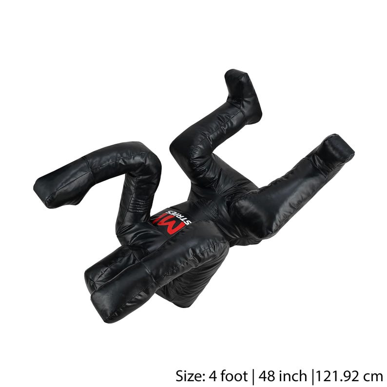May include: Black freestanding training dummy with a red "MMA Street" logo. The dummy is in a fighting pose with arms and legs bent. It is 4 feet tall, 48 inches, or 121.92 cm.