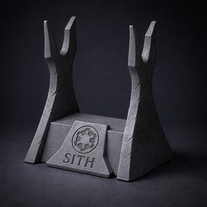 May include: A dark gray lightsaber display stand with a textured surface. The stand features two upright supports and a base with the word "SITH" and a circular emblem. The overall design is reminiscent of a sci-fi theme.