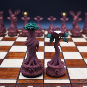 May include: A unique chess set featuring intricately designed pieces. The pieces are primarily a deep burgundy color, with some pieces having green or yellow accents. The chess board is a classic brown and white checkered pattern.
