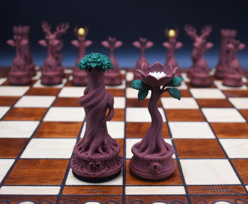 May include: A unique chess set featuring intricately designed pieces. The pieces are primarily a deep burgundy color, with some pieces having green or yellow accents. The chess board is a classic brown and white checkered pattern.