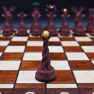 May include: A unique chess set featuring intricately designed pieces. The pieces are a deep burgundy color, with some pieces resembling trees and others with deer antlers. The board is made of wood with a checkerboard pattern.
