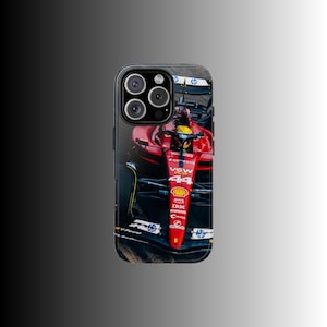 May include: A phone case displaying a red Formula 1 racing car. The car has the number 44 and sponsor logos. The case is black with a glossy finish and has a camera cutout.