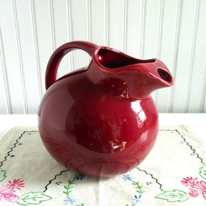 Vintage Cranberry Red Ceramic Ball Pitcher marked USA image 1