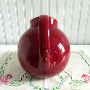 Vintage Cranberry Red Ceramic Ball Pitcher marked USA image 2