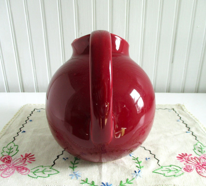 Vintage Cranberry Red Ceramic Ball Pitcher marked USA image 2