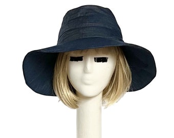 May include: A wide-brimmed navy blue sun hat with a simple design.