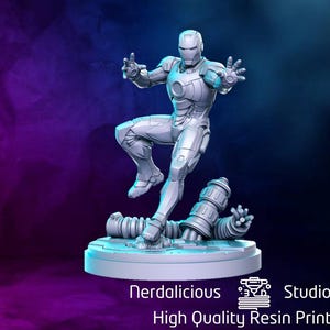 May include: A gray, 3D printed miniature of Iron Man in a dynamic pose, standing on a base with a pipe-like design. The miniature is part of a collection of high-quality resin prints.