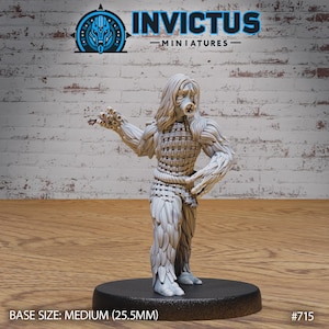 May include: A detailed miniature figure of a humanoid creature with a mask and textured clothing. The figure is light gray and stands on a black base. The figure's base size is medium (25.5mm). The Invictus Miniatures logo is visible.
