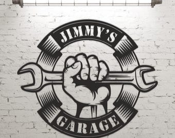 May include: Black and white metal sign with a wrench, a fist holding the wrench, and the text "JIMMY'S GARAGE".
