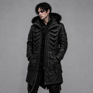 May include: A black long-length coat featuring a hood with faux fur trim, a front zipper closure, and decorative rib-like structural elements across the chest. The coat includes multiple utility pockets, metal hardware, and a silver chain attachment.