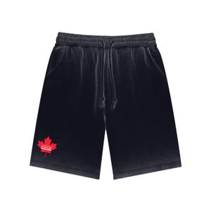 May include: Black shorts with a drawstring waist and pockets. A red maple leaf logo is on the left leg. The shorts are made of a soft, textured fabric. The shorts are a casual style.