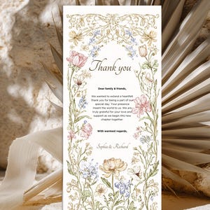 Elegant floral wedding invitation suite featuring pastel wildflowers and gold frame accents. Includes RSVP card, details card, and main invitation with botanical illustrations on a soft ivory background. Romantic and vintage-inspired design, perfect for spring or boho weddings.