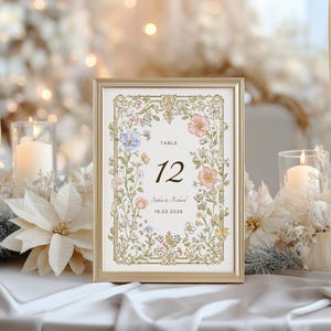 Elegant floral wedding invitation suite featuring pastel wildflowers and gold frame accents. Includes RSVP card, details card, welcome sign, thank you card, menu card, table number and main invitation with botanical illustrations on a soft ivory background. Romantic and vintage-inspired design, perfect for spring or boho weddings.