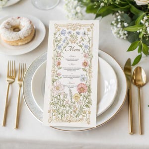 Elegant floral wedding invitation suite featuring pastel wildflowers and gold frame accents. Includes RSVP card, details card, welcome sign, thank you card, menu card, table number and main invitation with botanical illustrations on a soft ivory background. Romantic and vintage-inspired design, perfect for spring or boho weddings.