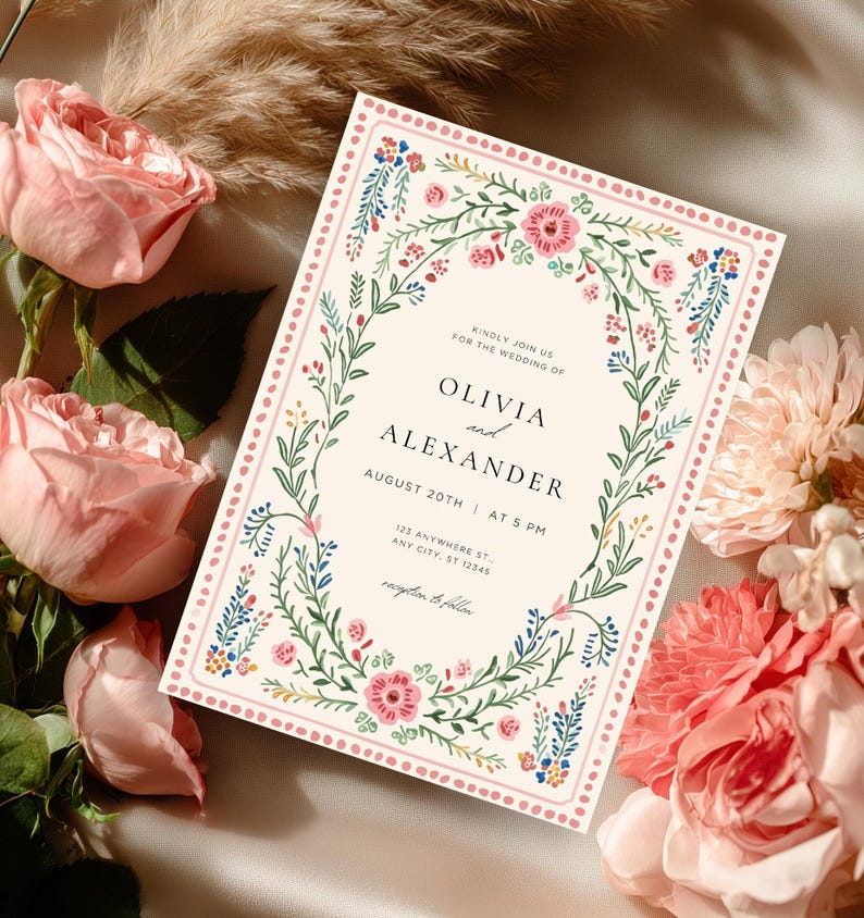 Vintage folk art floral wedding invitation template with blush dotted border and botanical frame, editable Canva printable wedding invite set.