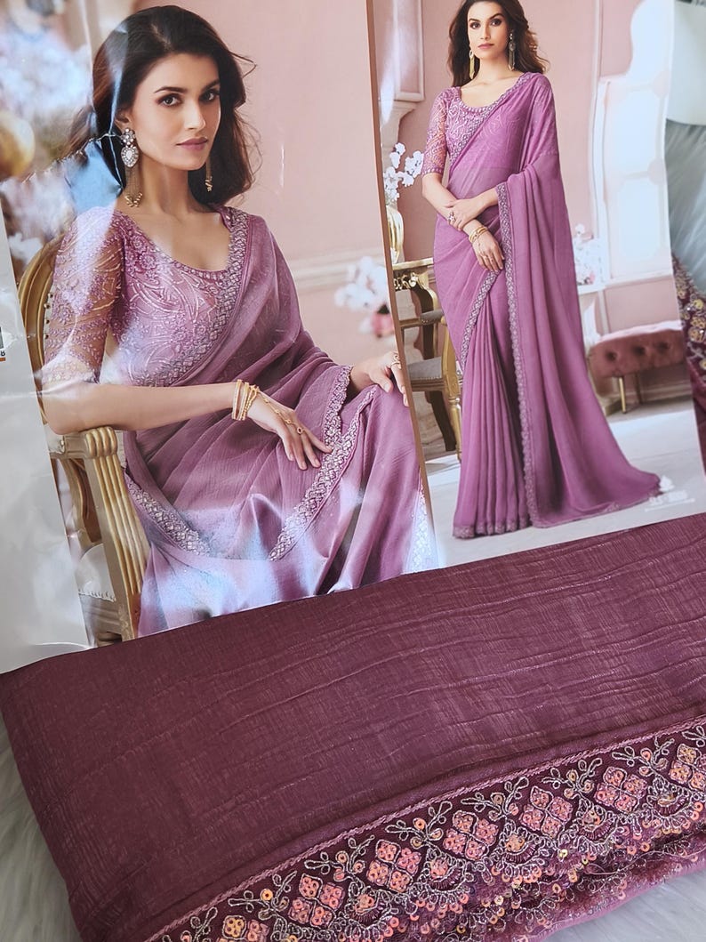 May include: A mauve-colored saree with intricate embroidery and sequin detailing. The saree features a matching blouse with embellished sleeves. The image shows a woman wearing the saree, showcasing its elegant drape and design.