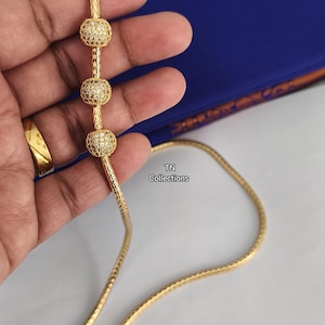 Mugappu kodi banhado a ouro micro, joia tradicional de casamento do sul da Índia.