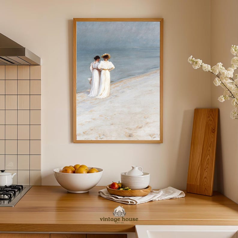 A grouped display of coastal printable wall art with several framed seaside images, including a lighthouse on rocky shore, a sailboat on still water, a sunset harbor scene, a coastal village by the sea, and a text-based nautical design reading Salt Air Adventure. The artwork uses gentle blue, cream, and soft golden tones with watercolor-style detail, creating a classic coastal grandmother mood with elegant nautical imagery and a calm, collected printable bundle look.