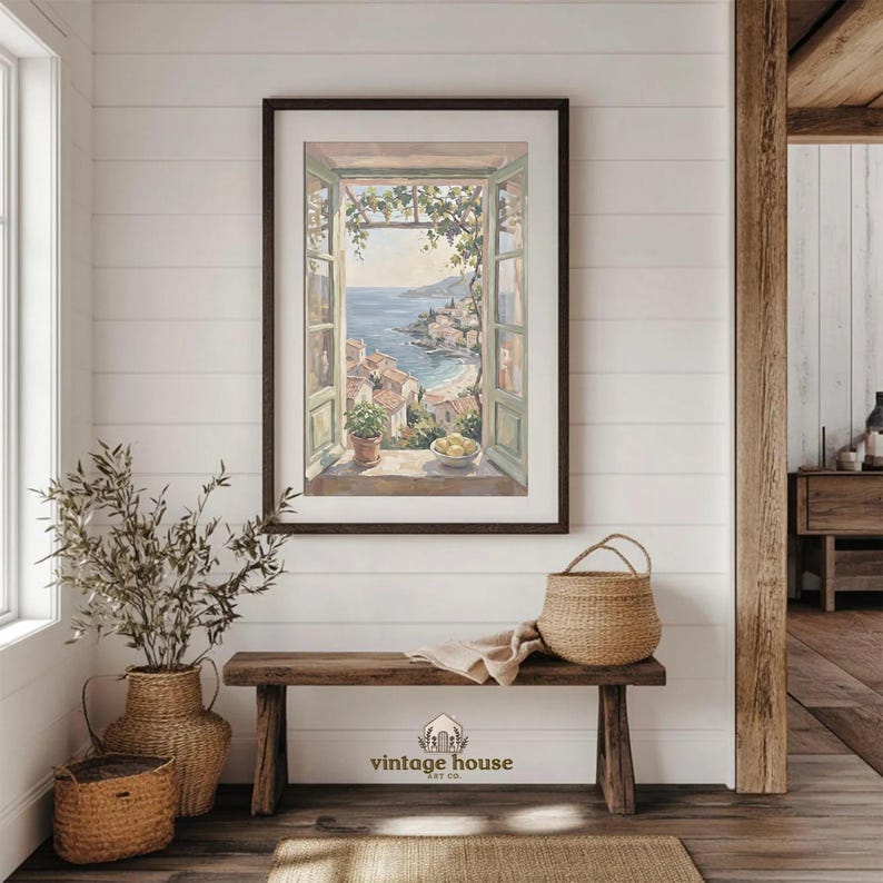 A grouped display of coastal printable wall art with several framed seaside images, including a lighthouse on rocky shore, a sailboat on still water, a sunset harbor scene, a coastal village by the sea, and a text-based nautical design reading Salt Air Adventure. The artwork uses gentle blue, cream, and soft golden tones with watercolor-style detail, creating a classic coastal grandmother mood with elegant nautical imagery and a calm, collected printable bundle look.