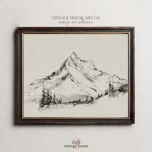 May include: A framed black and white mountain landscape art print. The artwork features a detailed sketch of a mountain range with trees in the foreground. The frame is dark brown with a gold inner edge. The text "VINTAGE HOUSE ART CO vintage art collective" is at the top.