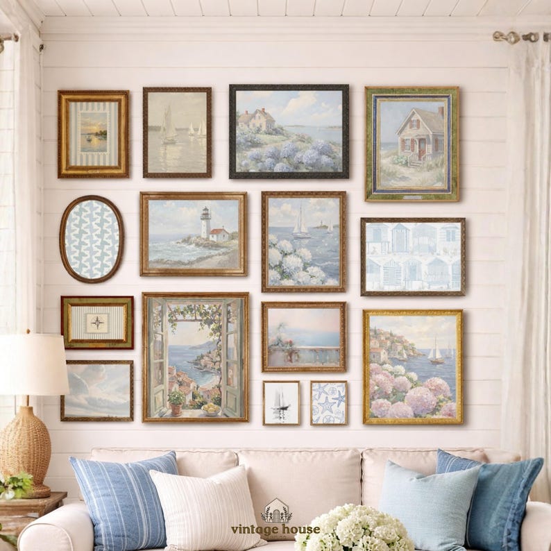 A grouped display of coastal printable wall art with several framed seaside images, including a lighthouse on rocky shore, a sailboat on still water, a sunset harbor scene, a coastal village by the sea, and a text-based nautical design reading Salt Air Adventure. The artwork uses gentle blue, cream, and soft golden tones with watercolor-style detail, creating a classic coastal grandmother mood with elegant nautical imagery and a calm, collected printable bundle look.