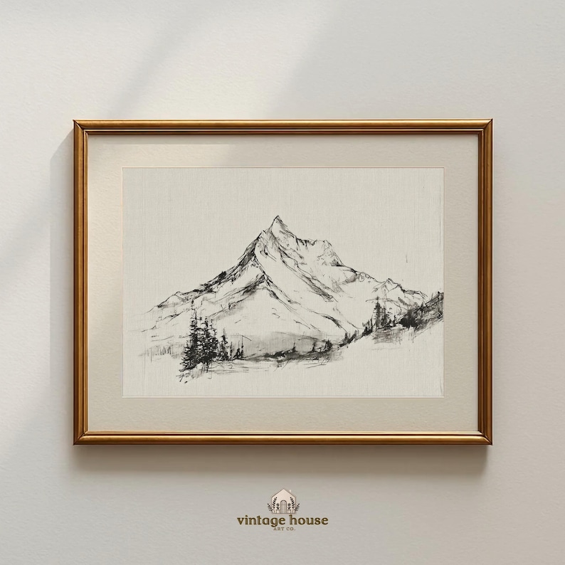 A timeless digital mountain sketch print designed for elegant, nature-inspired interiors. This printable wall art brings a calm, vintage feel to living rooms, bedrooms, offices, and cabin spaces.Vintage printable mountain wall art shown in a dark wood frame, featuring a black and white landscape sketch on a neutral background.Vintage printable mountain wall art shown in a dark wood frame, featuring a black and white landscape sketch on a neutral background.