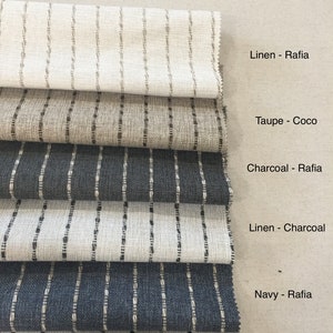 May include: Fabric swatches with vertical stripe designs in shades of beige, grey, and navy. Text reads "Performance Grain Stripe, Great for Kids and Pets! Spot clean stains away."