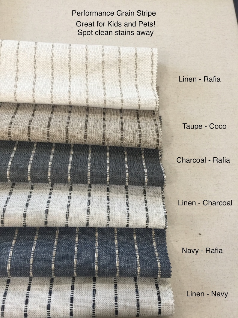 May include: Fabric swatches with vertical stripe designs in shades of beige, grey, and navy. Text reads "Performance Grain Stripe, Great for Kids and Pets! Spot clean stains away."