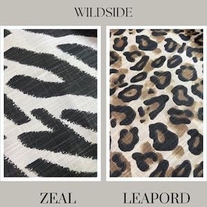 May include: Two fabric swatches with animal print patterns. The left swatch has a black and white zebra stripe design. The right swatch displays a leopard print in shades of brown and tan. The word "WILDSIDE" is at the top, with "ZEAL" and "LEAPORD" at the bottom.