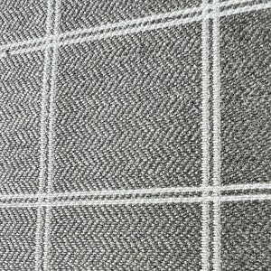 May include: A close-up of a grey fabric with a white windowpane pattern. The fabric has a textured weave.