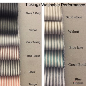 May include: A close-up of fabric swatches in various colors and patterns, including black and gray, carbon, gray ticking, red ticking, black, mango, sand stone, walnut, blue lake, green bottle, and blue denim. The swatches are labeled with their corresponding names. The text "Ticking/Washable Performance" is at the top of the image.