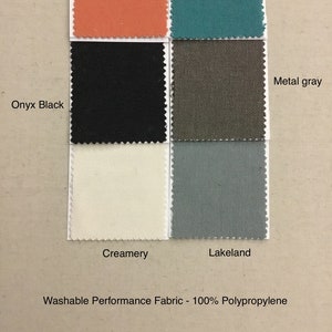 May include: Swatch card showing 10 fabric samples in various colors, including teal, mango solid, onyx black, metal gray, creamery, and lakeland. The card is labeled "Washable Performance Fabric - 100% Polypropylene".
