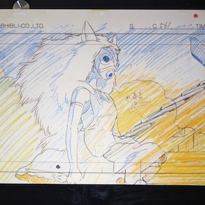 May include: A black and white pencil drawing of a woman with long, flowing hair wearing a mask and a dress. The drawing is on a white background with yellow and blue lines.