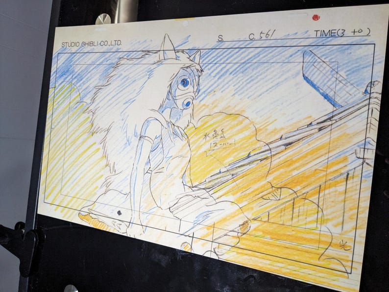 May include: A black and white pencil drawing of a female character with long white hair and a mask. The character is wearing a long white dress and is sitting on a wooden structure. The drawing is on a white background with blue and yellow lines. The text "STUDIO GHIBLI CO. LTD" is in the top left corner. The text "S C.t6/ TIME(3 +0)" is in the top right corner.