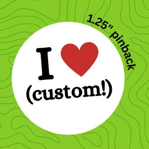 May include: A white circle pinback button with a red heart and the text "I (custom!)" in black. The button is 1.25 inches in diameter.