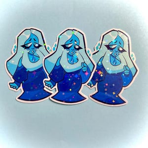 May include: Three stickers featuring a cartoon character with light blue hair and a blue dress. The character has a sad expression and a diamond-shaped gem on their chest. The stickers have a holographic effect with star-shaped accents.