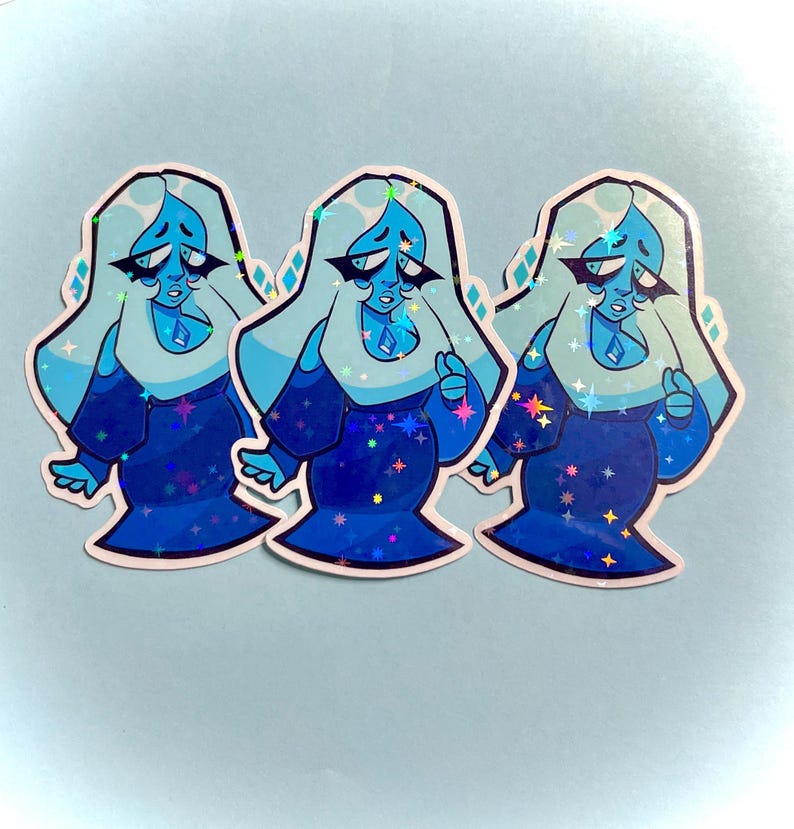 May include: Three stickers featuring a cartoon character with light blue hair and a blue dress. The character has a sad expression and a diamond-shaped gem on their chest. The stickers have a holographic effect with star-shaped accents.