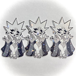 May include: Three stickers featuring a stylized cartoon character with a diamond-shaped head and a cape. The character is primarily gray and white with black accents and a sparkling, iridescent finish. The cape is dark gray with star details.