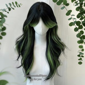 May include: A long, wavy wig with black and green highlights. The wig features a center part and face-framing layers. The text "Justsomestuff4you wig for you" is visible at the bottom. The wig is displayed on a mannequin head.