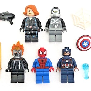 May include: A collection of Lego minifigures featuring characters from the Marvel universe. Includes Black Widow, Ghost Rider, Spider-Man, Captain America, and other accessories like a shield, weapon, and web.