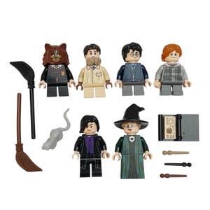 May include: A collection of six plastic minifigures featuring various character designs, including one with a cat mask, one with a witch hat, and one with dark hair. Accessories include two brooms, a gray rat, a book, and three small wands.